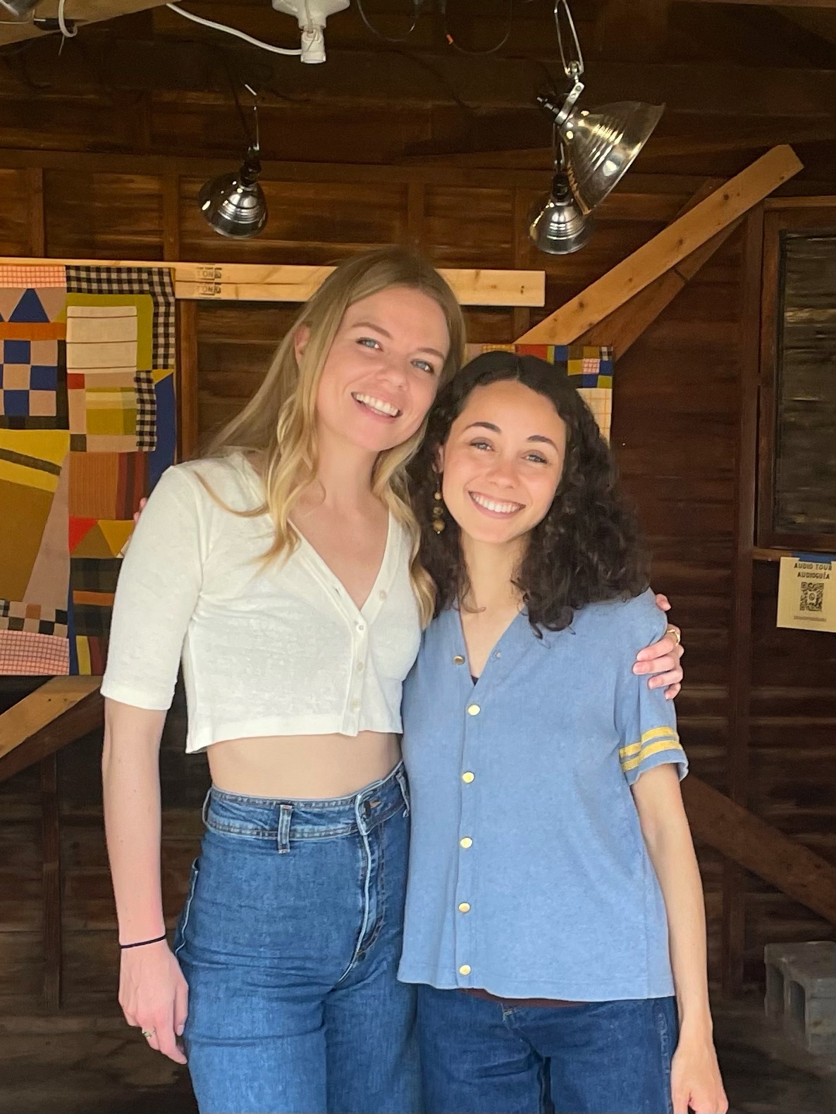 Populus Fund 2024 Grantees Joelle a biracial woman with a light skin tone and curly dark brown hair and Shelby a white woman with blond hair embrace and smile at the camera