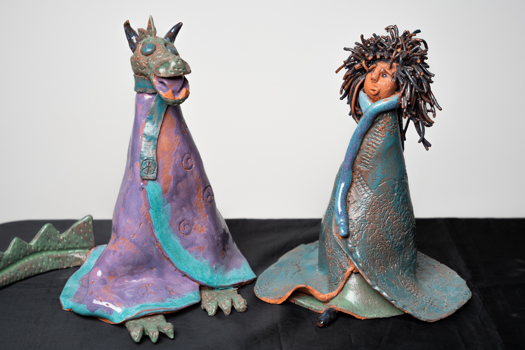 Whimsical Ceramics Happenings Two Ceramic Figures One A Person and One A Dragon